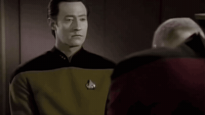 Bald Man Close Up Looking At Camera GIF