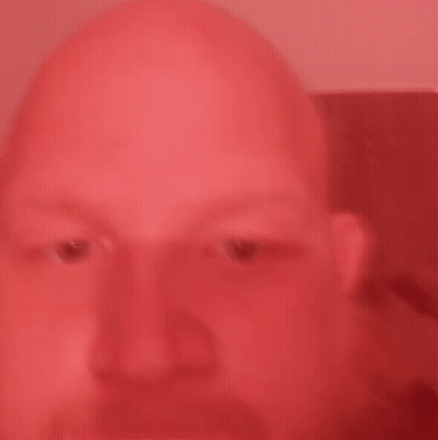 Bald Man Close Up Red Background GIF