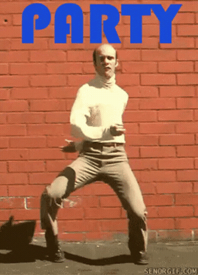 Bald Man Dancing In Front Of Red Brick Wall Saying Party GIF
