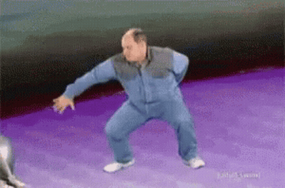 Bald Man Dancing On Purple Surface GIF