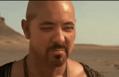 Bald Man Desert Eyes Closed And Mouth Open GIF