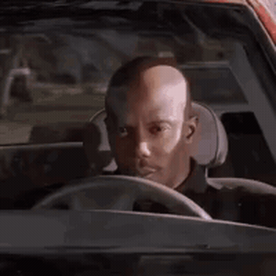 Bald Man Driving Car Looking Out Window GIF