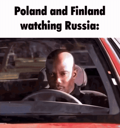 Bald Man Driving Red Car Watching Russia Poland Finland GIF