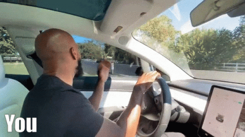 Bald Man Driving Tesla Model 3 GIF