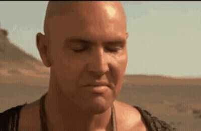 Bald Man Eyes Closed Mouth Open Desert GIF