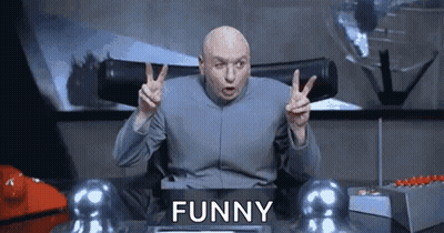 Bald Man Giving Peace Sign At Desk Saying Funny GIF