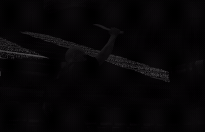 Bald Man Holding Knife In Front Of Screen GIF