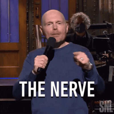 Bald Man Holding Microphone Saying The Nerve GIF