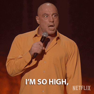 Bald Man Holding Microphone Says I'm So High GIF