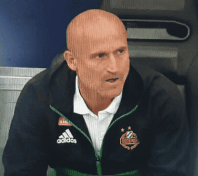 Bald Man In Adidas Jacket Sitting In Chair GIF