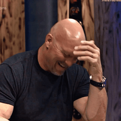 Bald Man In Black Shirt Covering Face With Hand GIF
