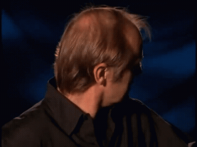 Bald Man In Black Shirt Making Funny Face GIF