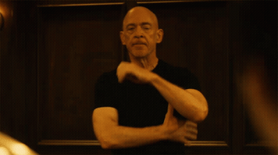 Bald Man In Black Shirt Making Funny Face GIF