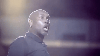 Bald Man In Black Shirt Making Funny Face GIF