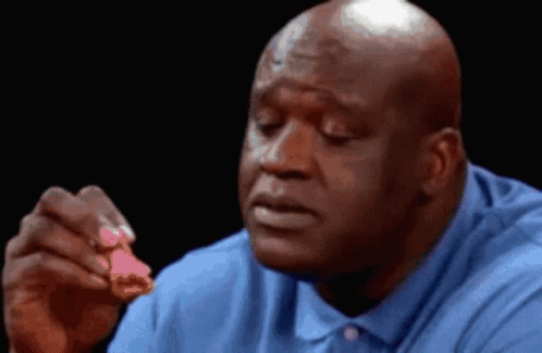Bald Man In Blue Shirt Eating Piece Of Chicken GIF