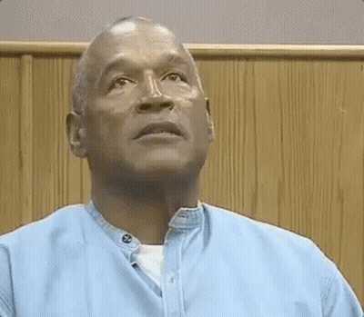 Bald Man In Blue Shirt Looking Up GIF
