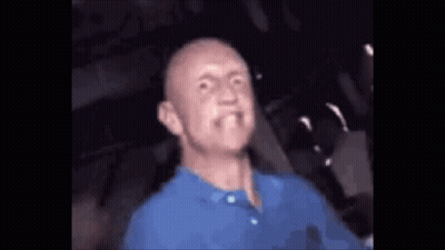 Bald Man In Blue Shirt Making Funny Face GIF