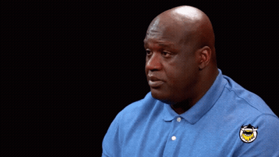 Bald Man In Blue Shirt With Shark Patch GIF
