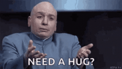 Bald Man In Blue Suit Asking For A Hug GIF