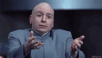 Bald Man In Blue Suit Making Gesture GIF