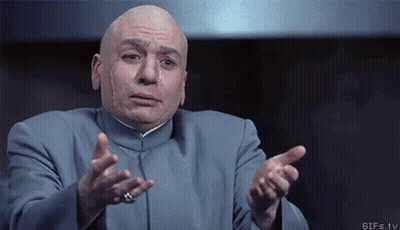 Bald Man In Blue Suit Pointing At Camera GIF