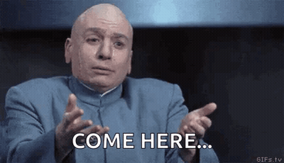 Bald Man In Blue Suit Saying Come Here GIF
