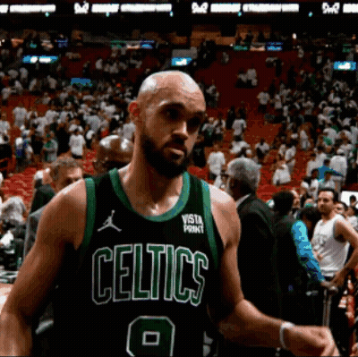 Bald Man In Celtics Jersey In Front Of Crowd GIF