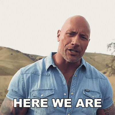 Bald Man In Denim Shirt Says Here We Are GIF