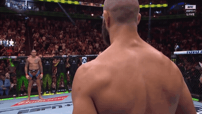 Bald Man In Front Of Budweiser Banner GIF