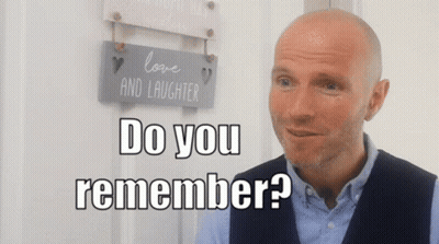 Bald Man In Front Of Love And Laughter Sign Saying Do You Remember GIF