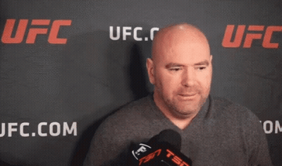 Bald Man In Front Of UFC Banner GIF