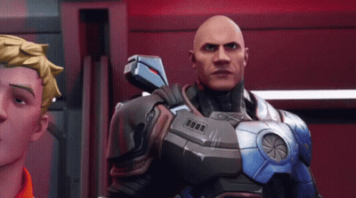Bald Man In Futuristic Suit Next To Man In Orange Shirt GIF