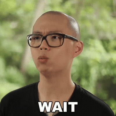 Bald Man In Glasses And Black Shirt Saying Wait GIF