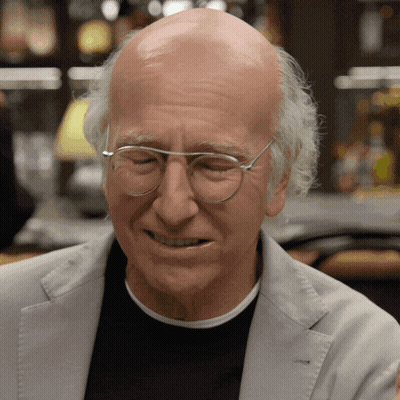 Bald Man In Glasses And Grey Jacket Smiling GIF