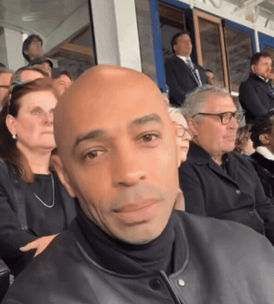 Bald Man In Glasses In Crowd GIF