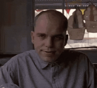 Bald Man In Gray Shirt Smiling GIF
