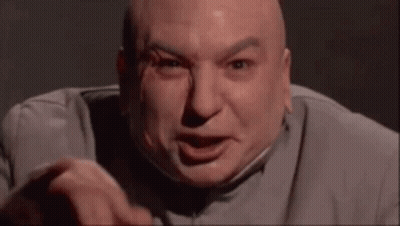 Bald Man In Gray Suit Making Funny Face GIF