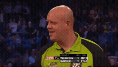 Bald Man In Green Shirt In Front Of Van Gerwen Scoreboard GIF