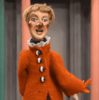 Bald Man In Green Sweater Making Funny Face GIF