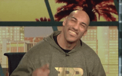 Bald Man In Hoodie Making Peace Sign GIF