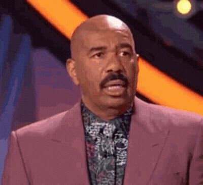 Bald Man In Pink Suit And Green Shirt GIF
