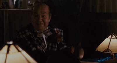 Bald Man In Plaid Shirt Giving Thumbs Up With Coin GIF