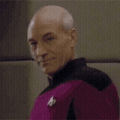 Bald Man In Purple Uniform Smiling GIF