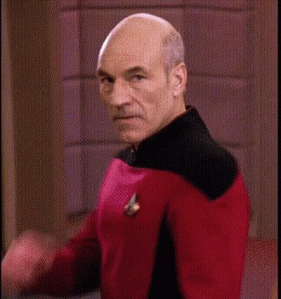 Bald Man In Red And Black Uniform Making Funny Face GIF
