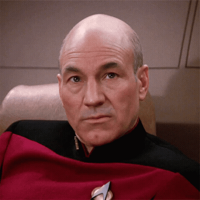 Bald Man In Red And Black Uniform With Commander Badge GIF