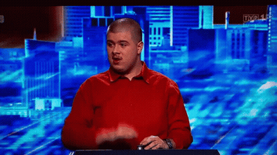Bald Man In Red Shirt In Front Of TV GIF