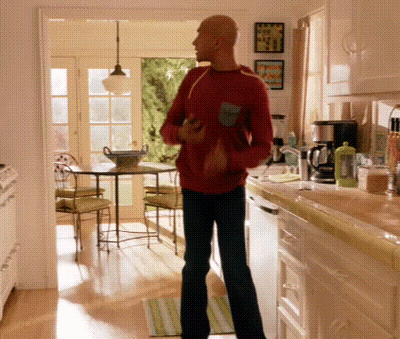 Bald Man In Red Shirt In Kitchen GIF