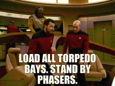 Bald Man In Red Shirt Sitting Saying Engage GIF