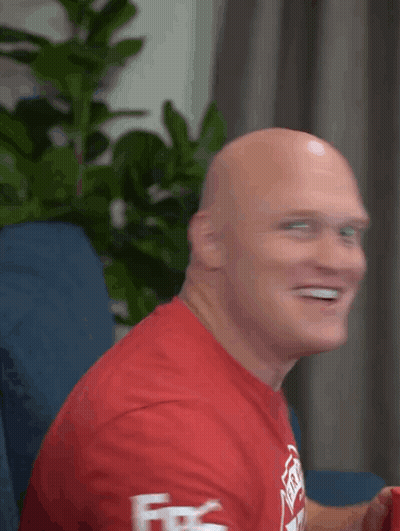 Bald Man In Red Shirt Smiling Fire GIF