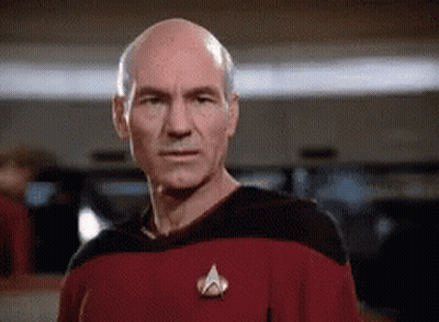 Bald Man In Red Shirt With Star Trek Pin GIF